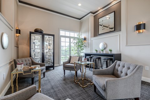 a living room with couches and chairs and a fireplace